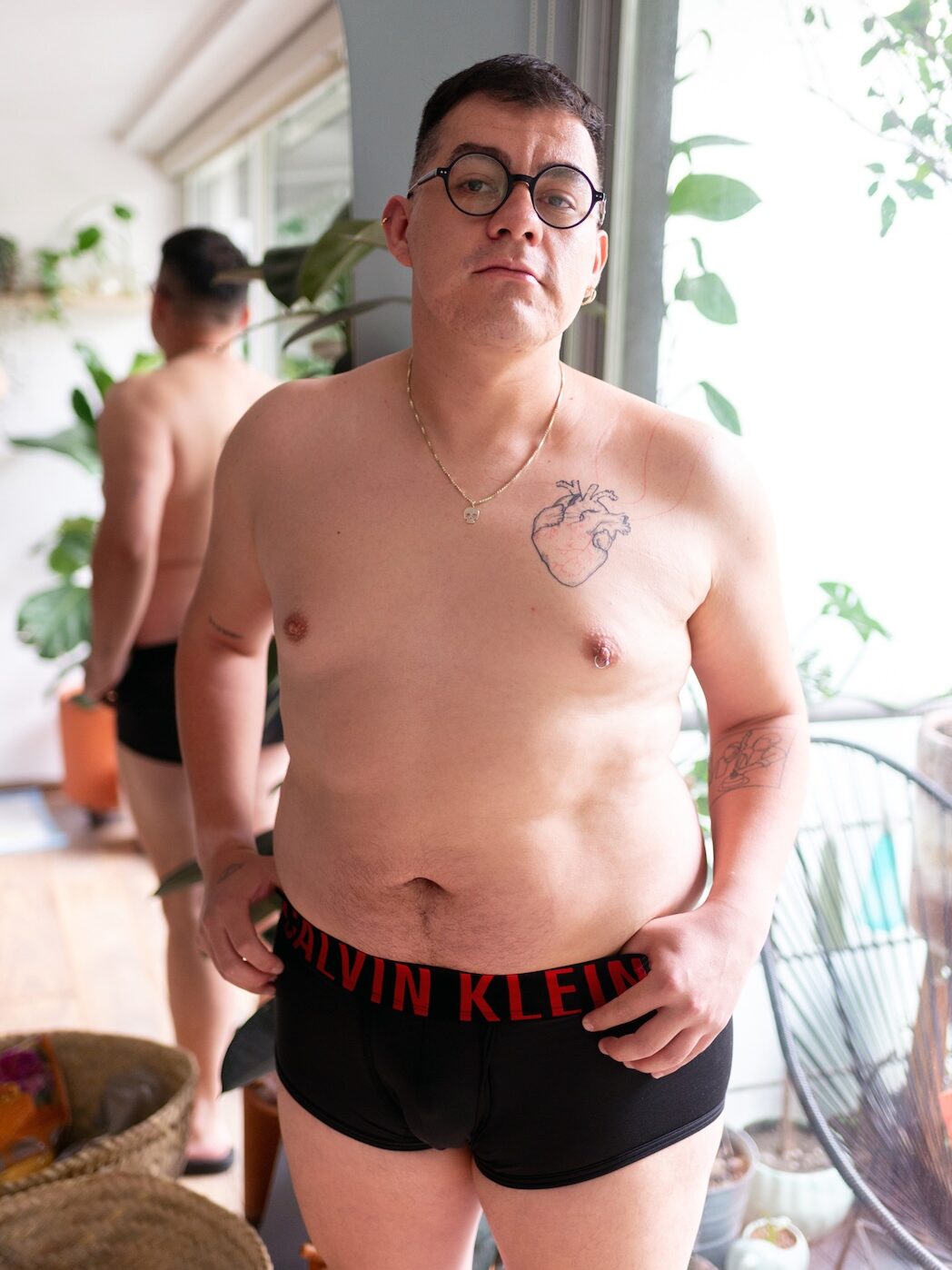 Edmundo M topless in black underwear with ted writing on waistband