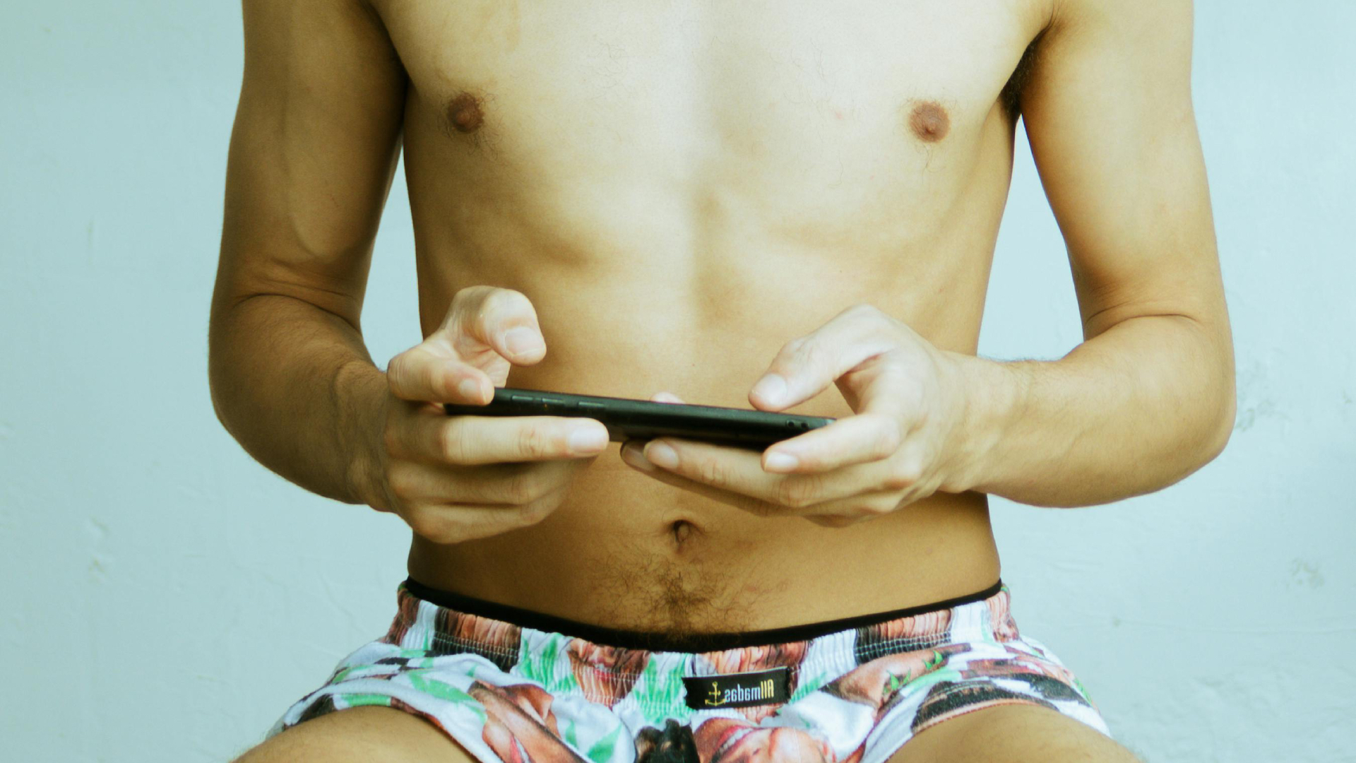 Topless male torso on this phone