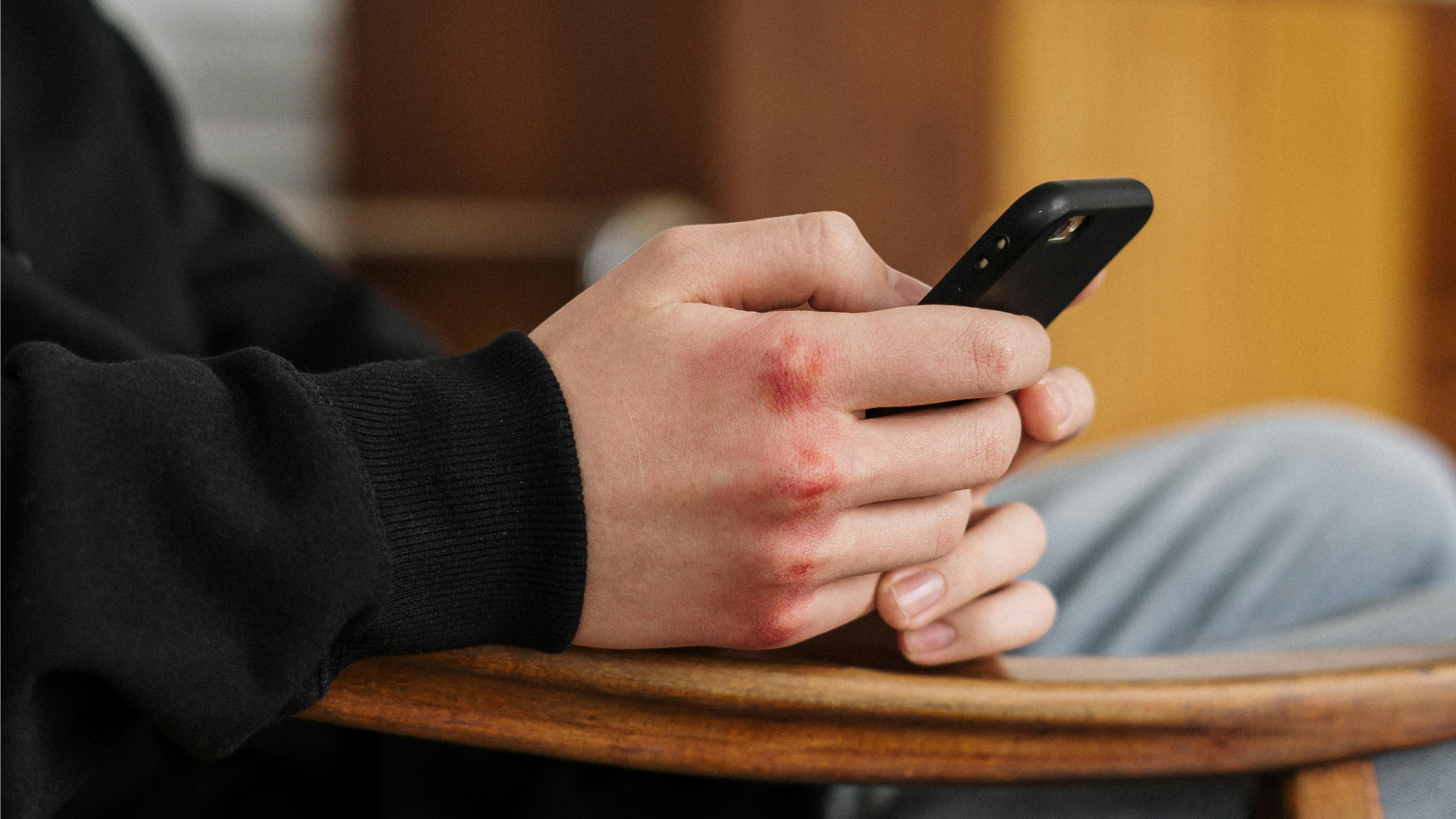 Teen holding a mobile phone