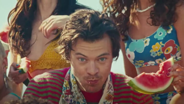 Harry Styles in Watermelon Sugar music video with watermelon juice dripping down his chin