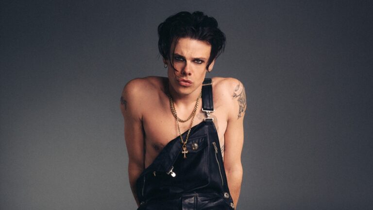 Yungblud in his new cover shoot for Attitude, in dungarees with one strap undone
