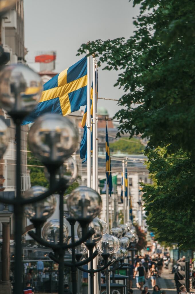 Swedish glass flying with Gothenburg city backdrop, portrait
