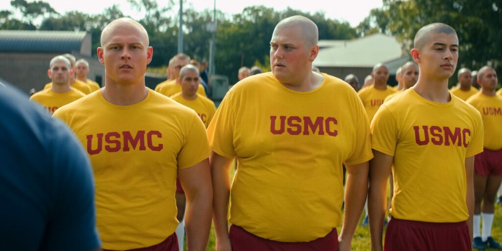 Brandon Tyler Moore as Cody Bowman and Blake Burt as John Bowman, wearing yellow t-shirts at bootcamp (Image: Netflix)