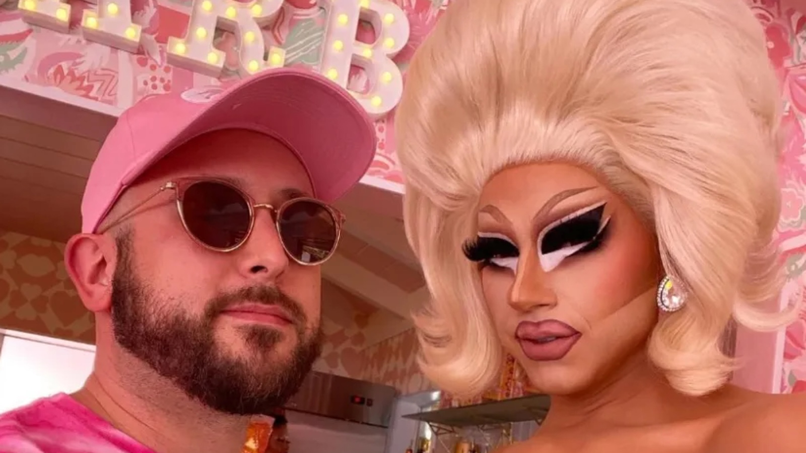 David Silver in a pink cap and sunglasses with Trixie Mattel in signature drag look
