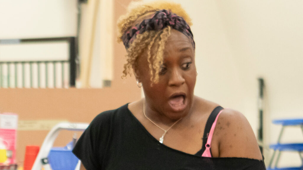 A cast member reacting with surprise during Fat Ham rehearsals.