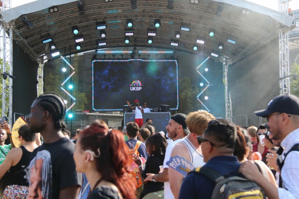 Crowd gathered at a stage UK Black Pride 2025