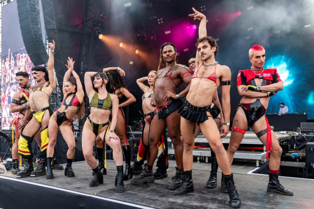 A group of dancers on the main stage of Brighton Pride 2025