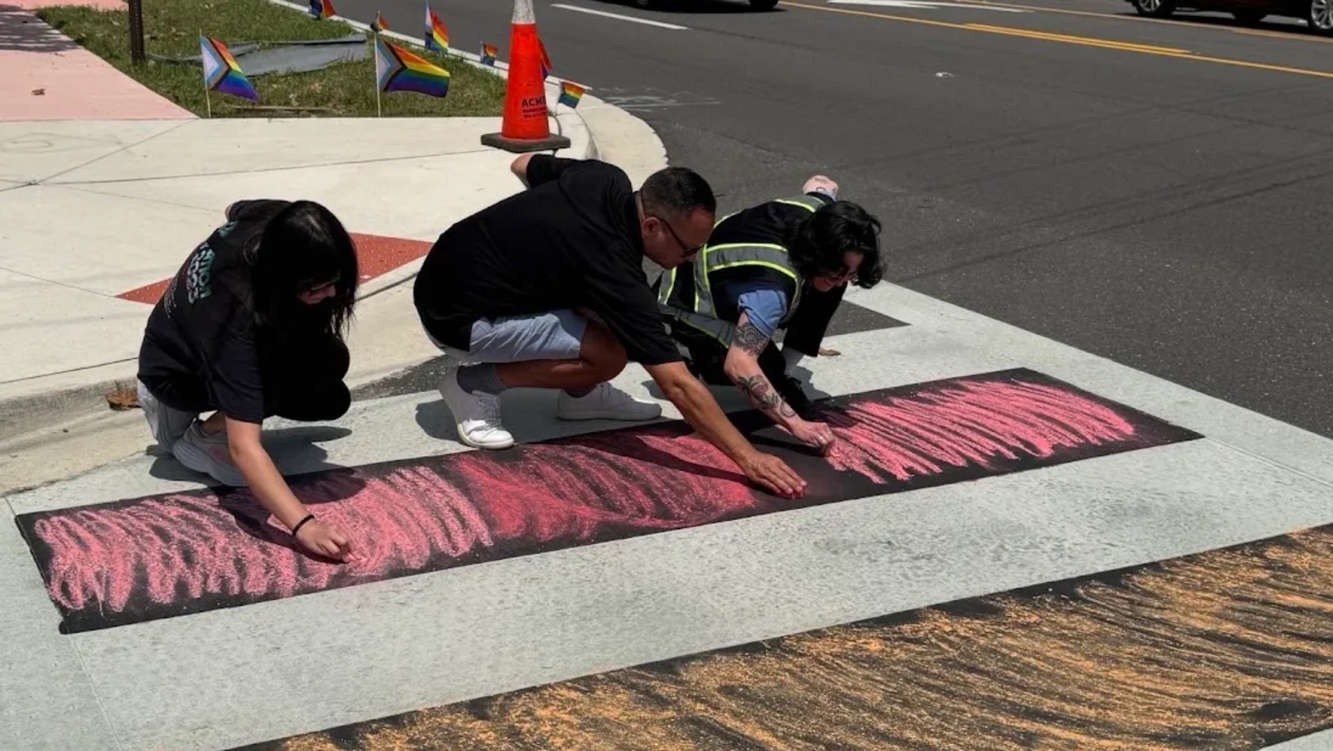 Pulse nightclub memorial protest where people are colouring in the painted over crossing