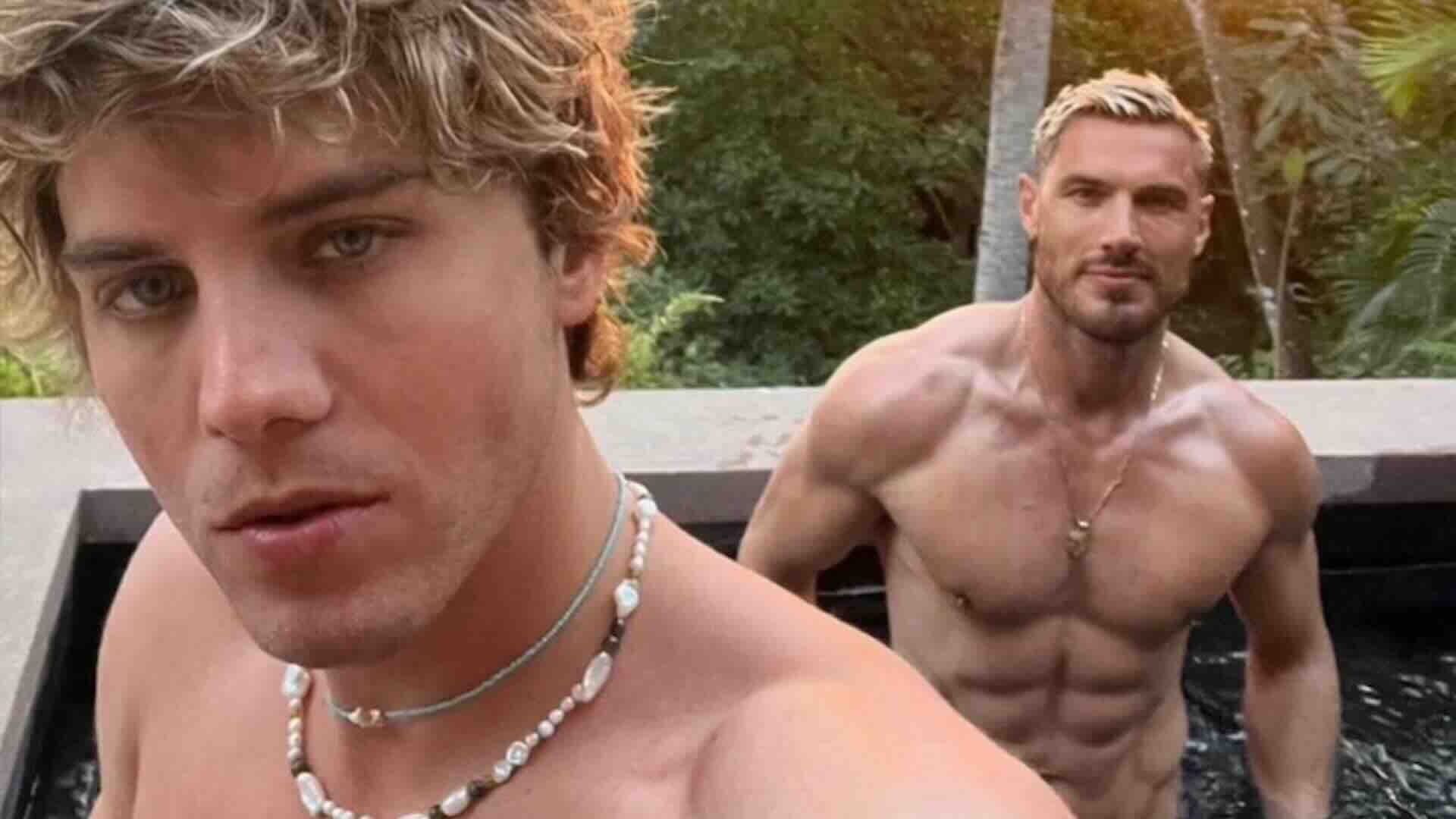 Lukas Gage and Chris Appletone pose shirtless in a pool