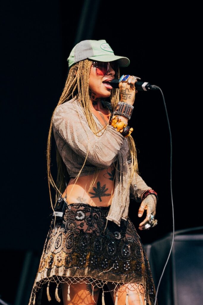 Greentea Peng in hat and shades and a vintage skirt