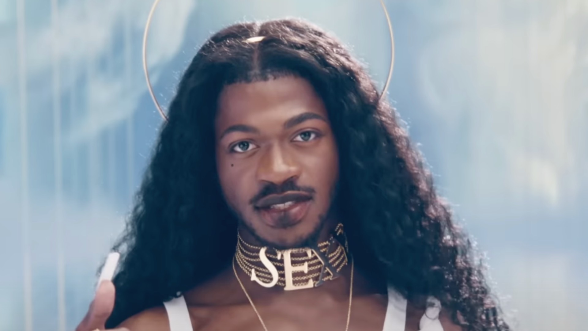 Lil Nas X wearing a weave, halo and S.E.X choker