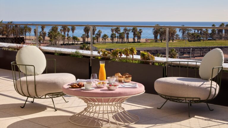 A terrace at SLS Barcelona, overlooking the sea