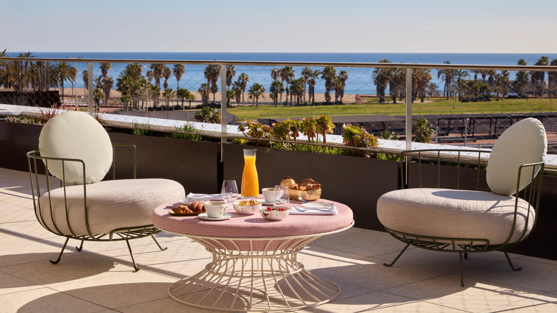 A terrace at SLS Barcelona, overlooking the sea