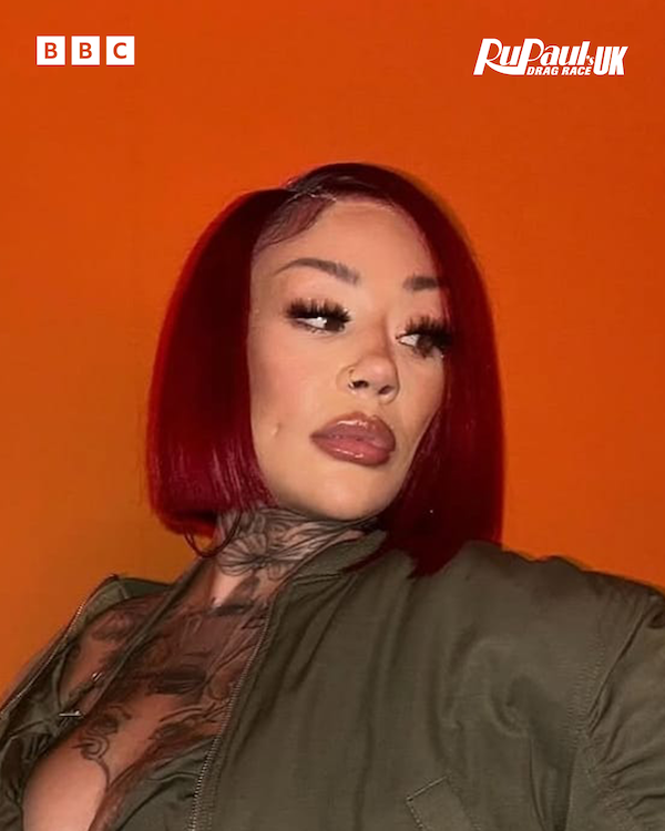 Mutya Buena with red hair wearing a green top