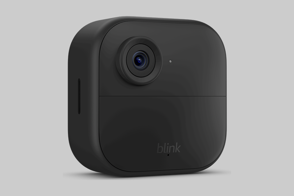 A black square security camera