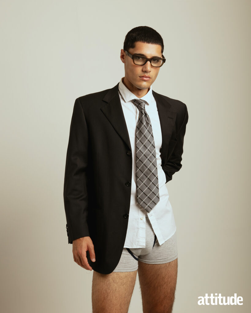 A model wears suiting and boxers in Attitude's menswear editorial. 