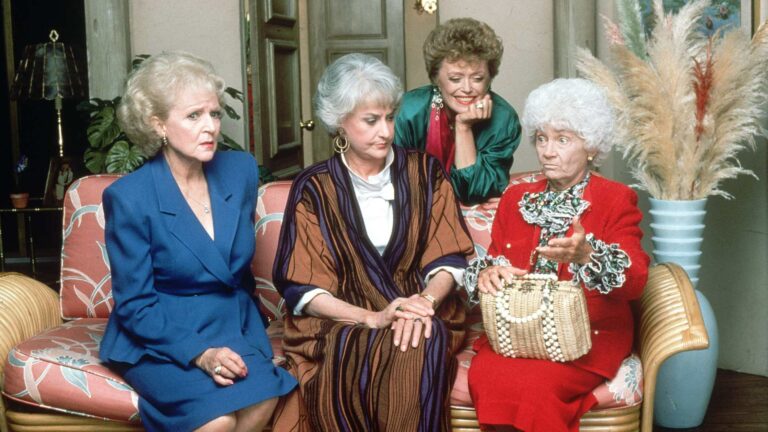 The Golden Girls cast sitting on a sofa together