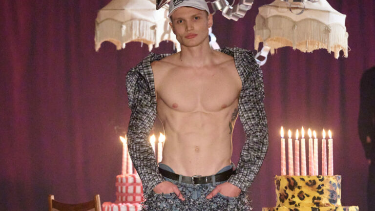 Maximilian Raynor's Spring/Summer 2026 collection showing a male model topless wearing a cap