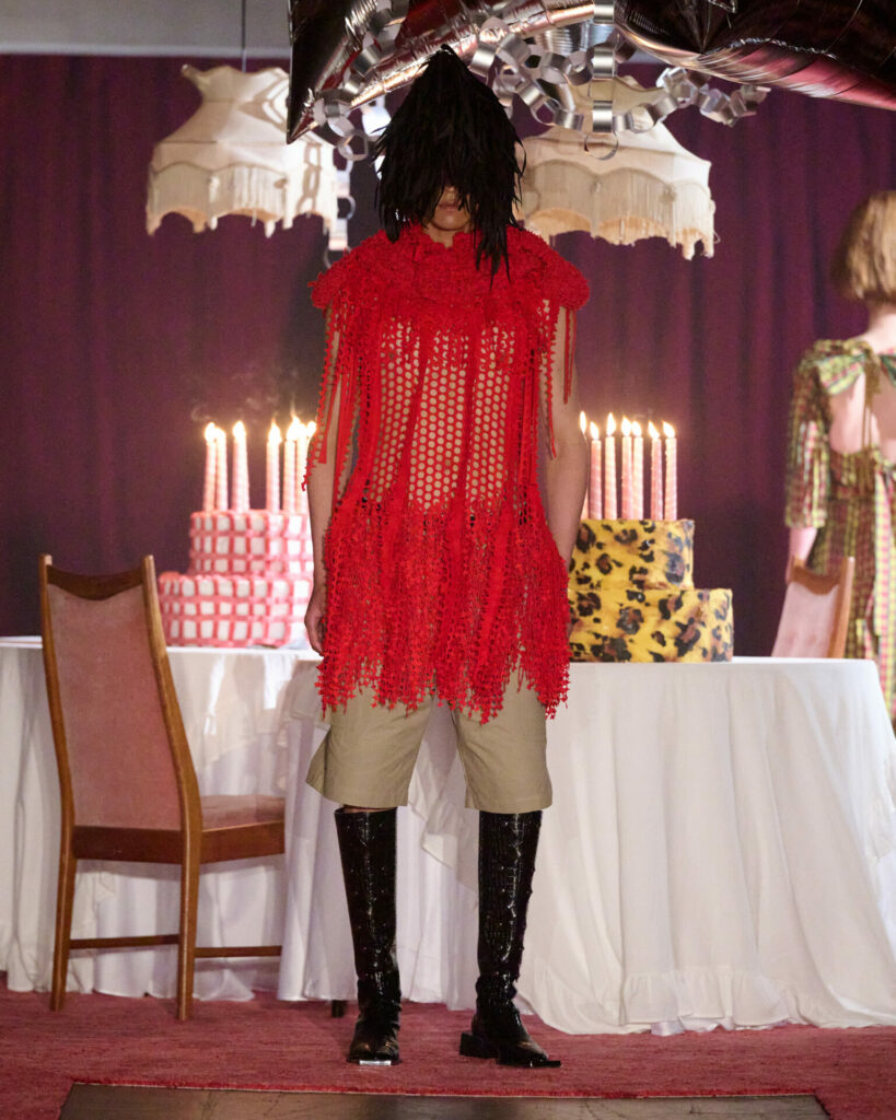 A mesh Red Coat and shorts from Maximilian Raynor's Spring/Summer 2026 collection