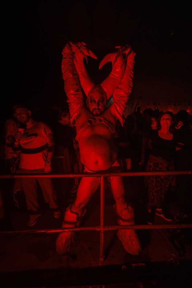 Man dressed as the devil in latex suit