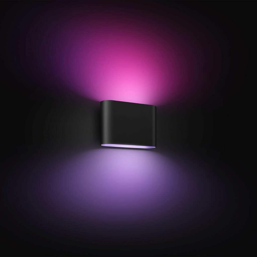 A black wall light giving off purple light