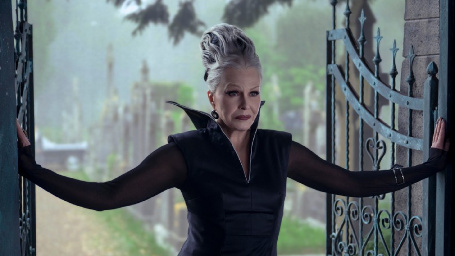 Joanna Lumley in a frankenstein wig and black collared dress