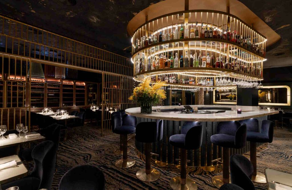 Interior shot of Maya Manchester, showing a circular bar with seating around it