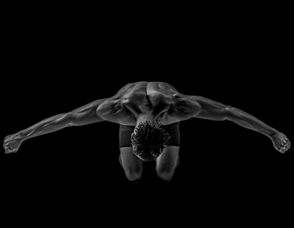 "Arms stretch wide and the chest lifts skyward in a gesture that feels both fragile and powerful. It shows a man in midlife releasing the silent weight he has carried for years. Resilience here is not found in clinging to control but in the courage to surrender, to let go, and to embrace vulnerability as strength."Arms stretch wide and the chest lifts skyward in a gesture that feels both fragile and powerful. It shows a man in midlife releasing the silent weight he has carried for years. Resilience here is not found in clinging to control but in the courage to surrender, to let go, and to embrace vulnerability as strength.
