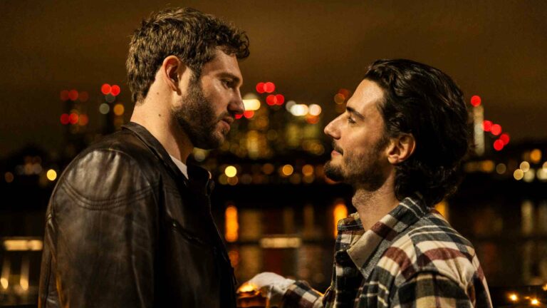 A still from the film A Night Like This showing the two male characters about to embrace