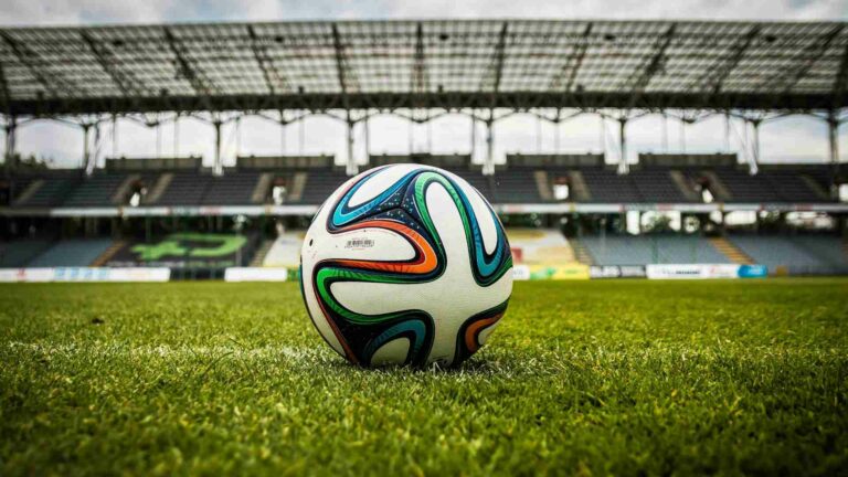 A football sitting on a football pitch