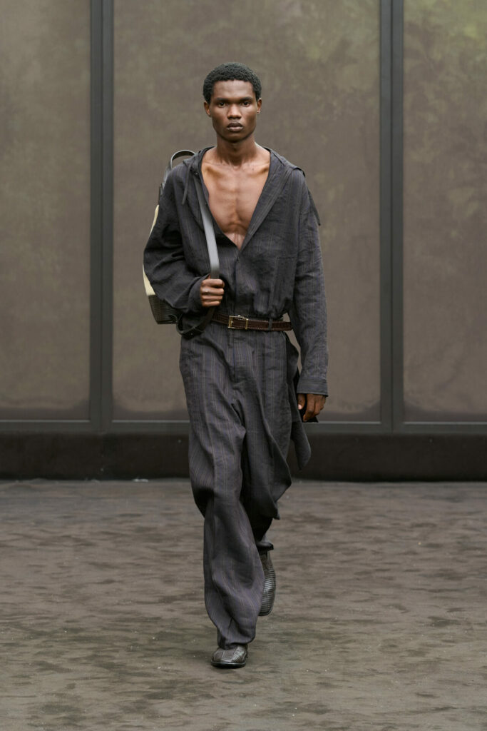 A model wears a billowing button-up at the Ferragamo Spring/Summer 2026 show at Milan Fashion Week.