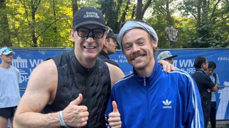 Harry Styles in running gear with Richard Whitehead