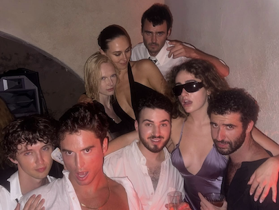 Troye Sivan and Benito Skinner looking sweaty as they dance with a group of celebrities 