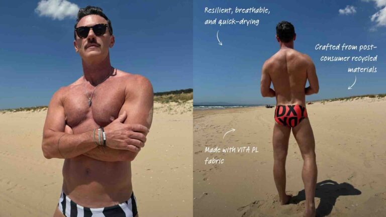 Luke Evans modelling swim briefs on a beach