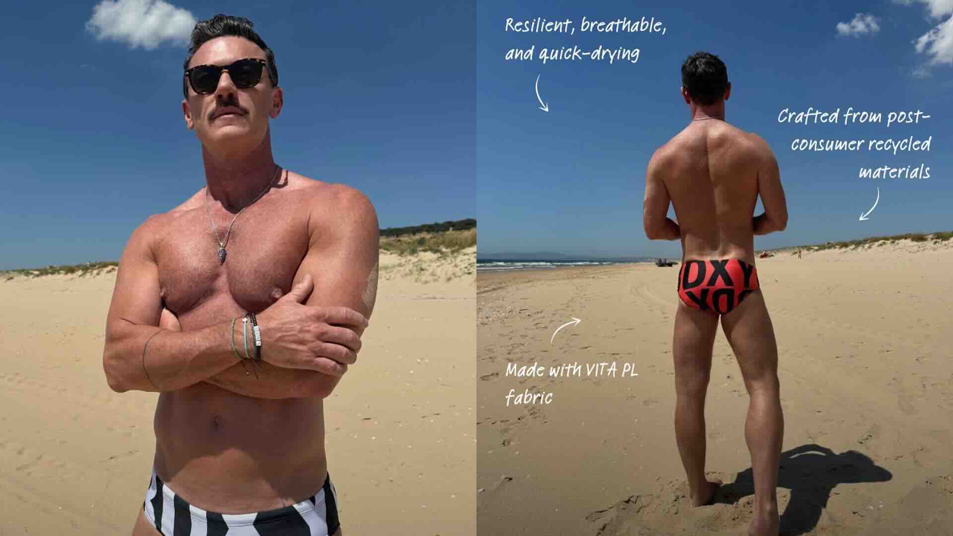 Luke Evans modelling swim briefs on a beach