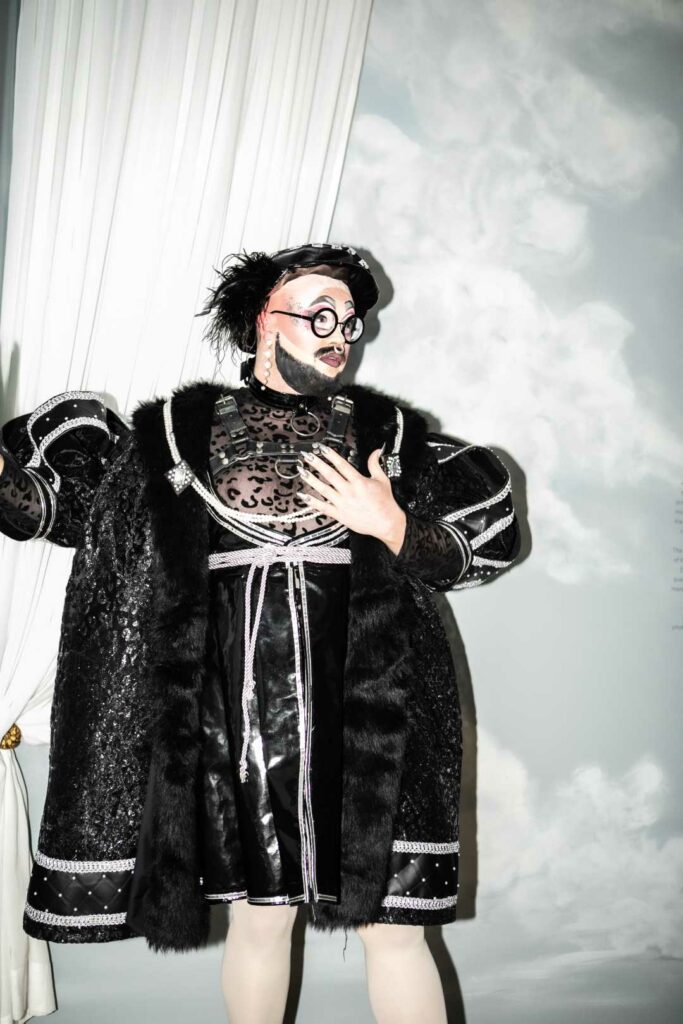 A drag artist in Henry VIII drag