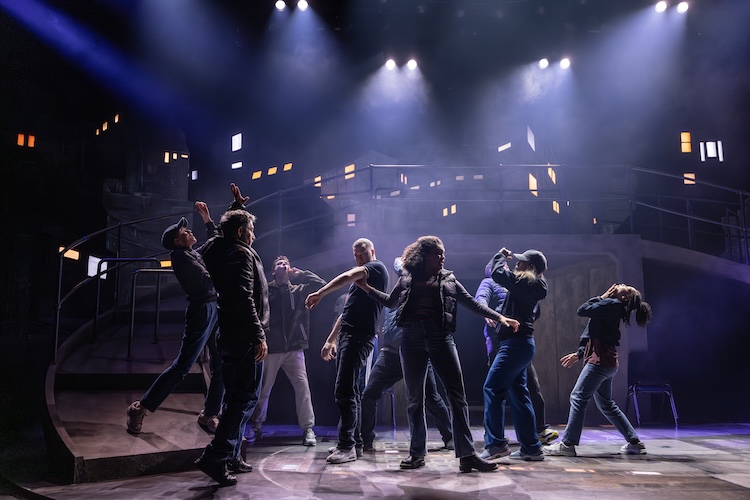 a group of people on stage in a circle