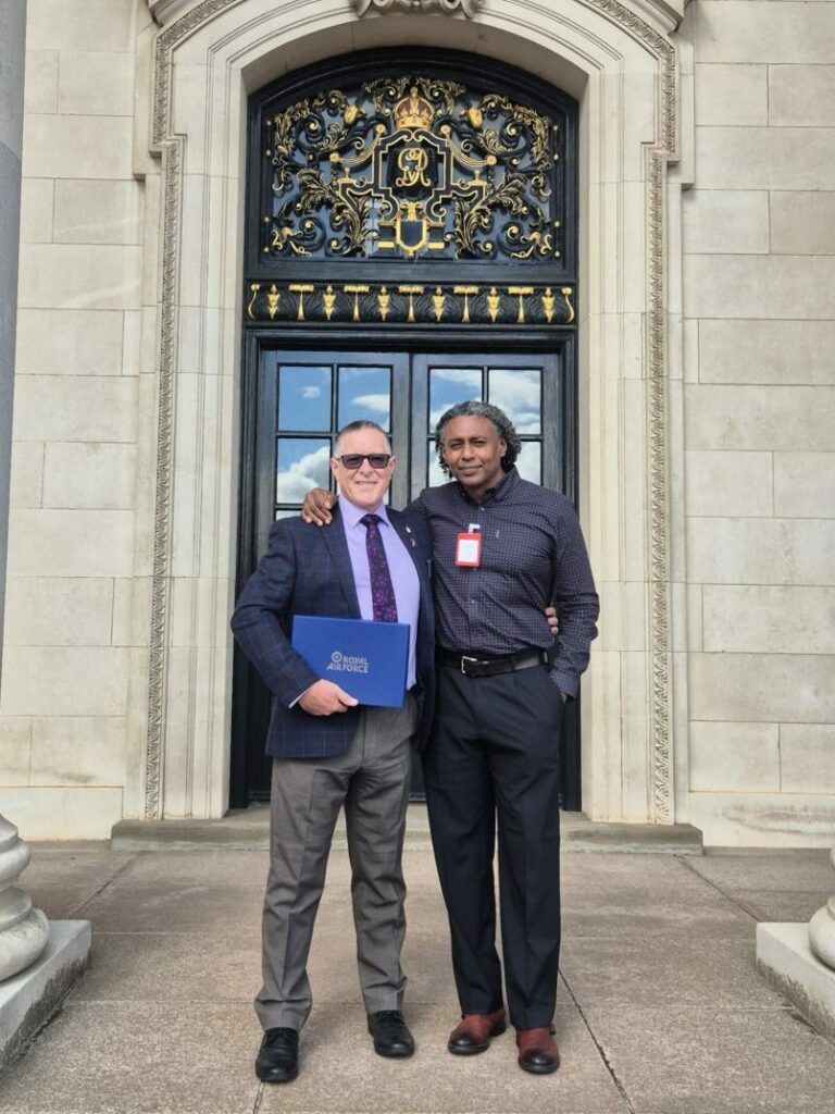 Graeme with his partner Jairzeno when he received The Etherton Ribbon in September 2024