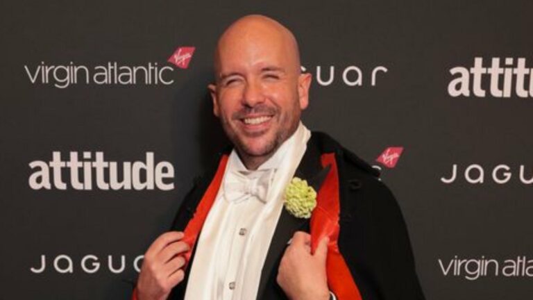 Tom Allen in a black cape at the attitude Awards
