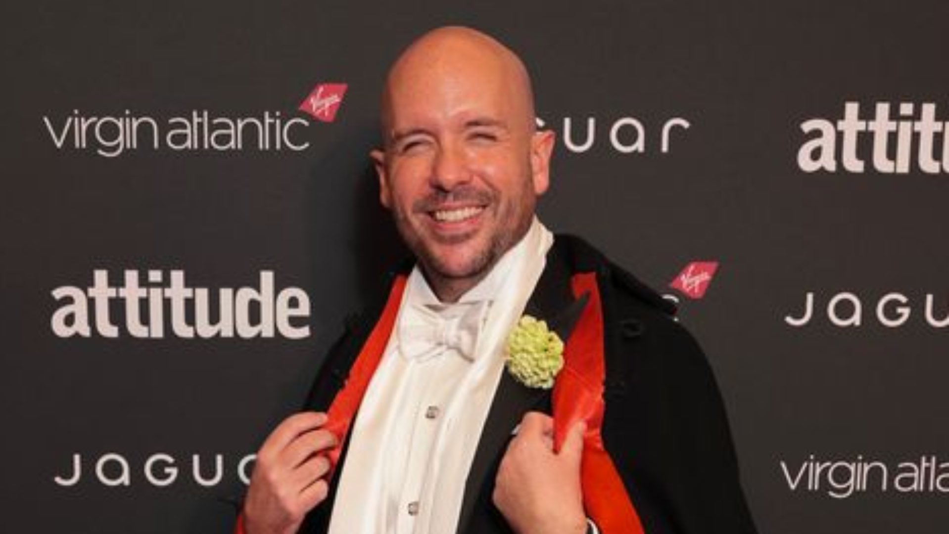 Tom Allen in a black cape at the attitude Awards