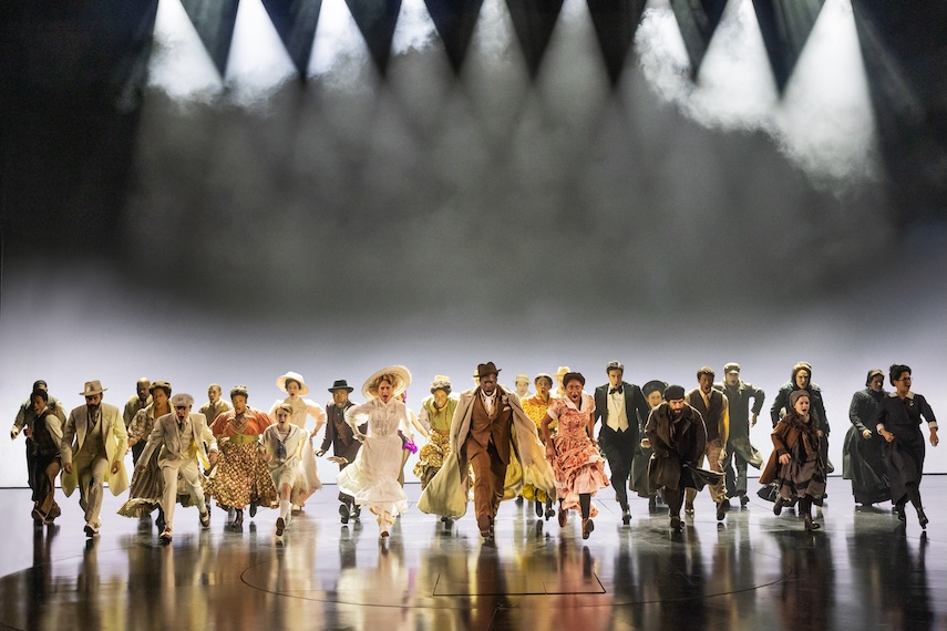 Cast of Ragtime marching towards the crowd