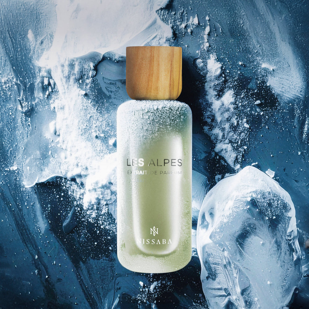 A lifestyle shot of the NISSABA Les Alpes perfume.