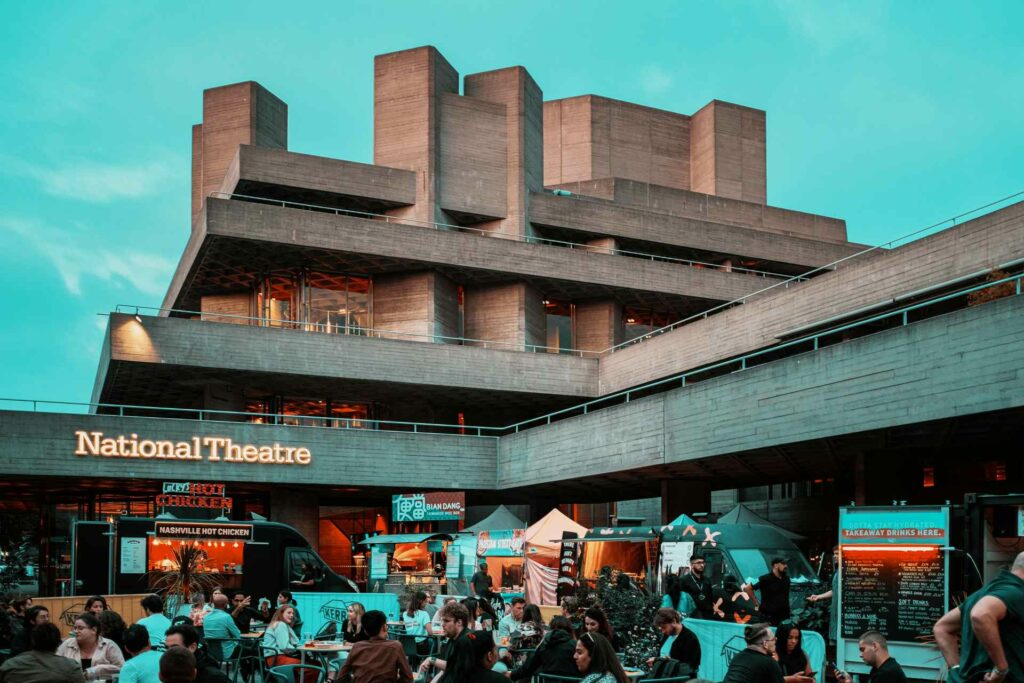 National Theatre showing people sitting outside