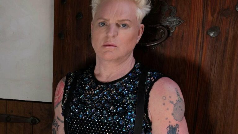 Andy Bell wearing a sleeveless vest with rhinestones on it