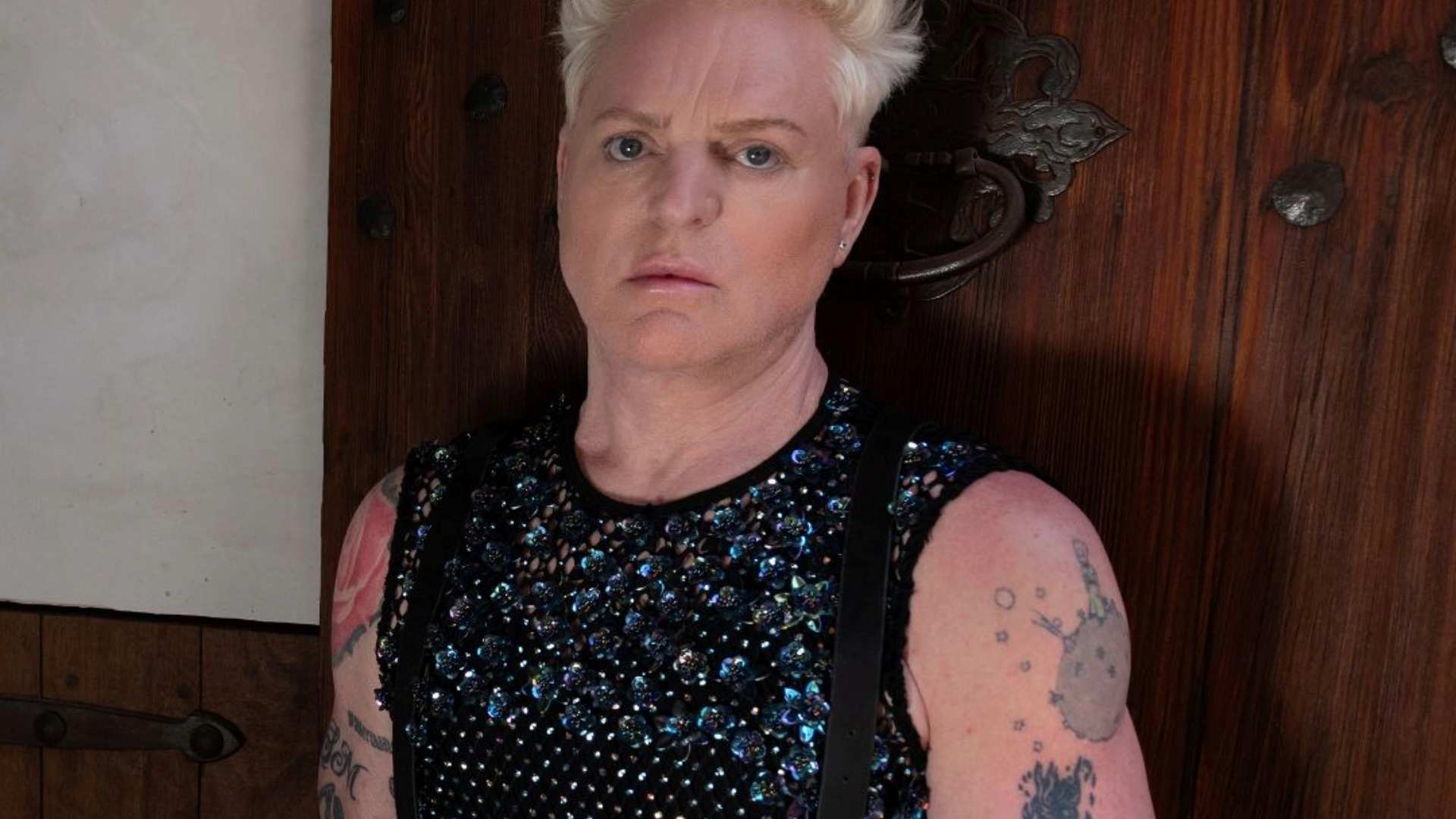 Andy Bell wearing a sleeveless vest with rhinestones on it