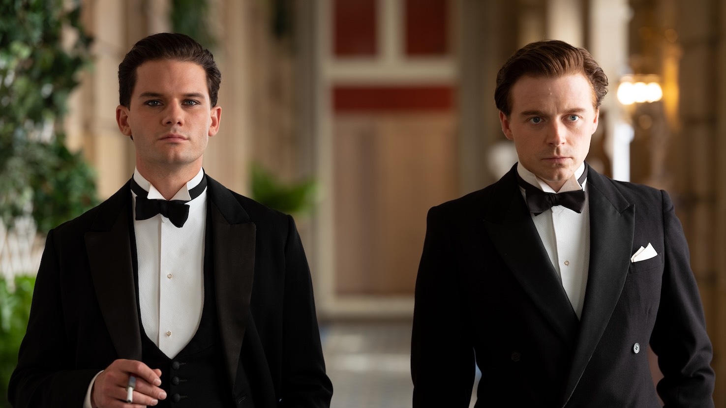 A still from Benediction, two men walking towards the camera in tuxedos, one smoking(Image: Provided)