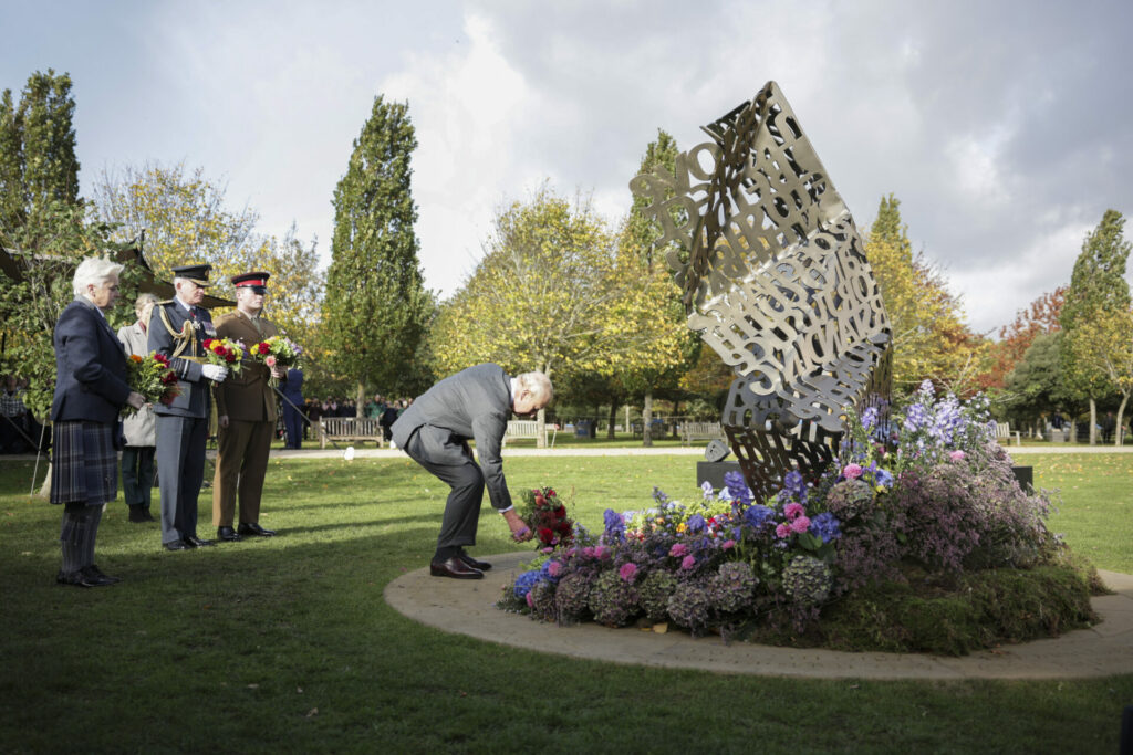 King Charles lays flowers at An Opened Letter memorial at the National Memorial Arboretum