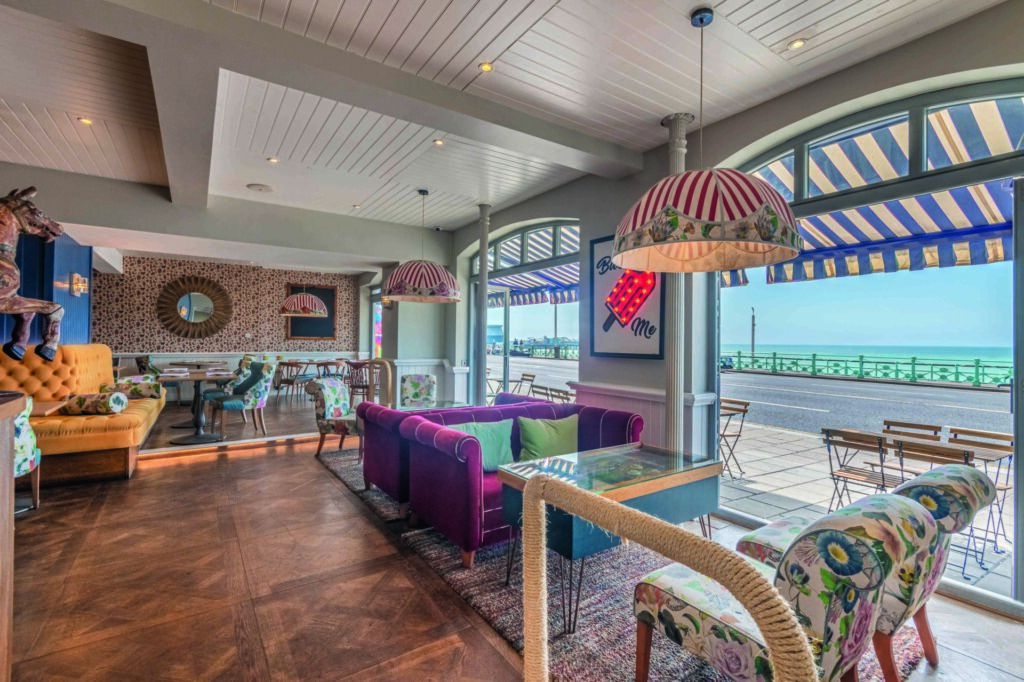 Seating in the HarBAR + Kitchen looking out onto the street