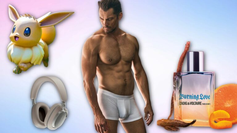 A shirtless David Gandy in white underwear stands in the centre, surrounded by a cartoon Eevee, beige headphones, and a bottle of Zadig & Voltaire Burning Love perfume with orange slices