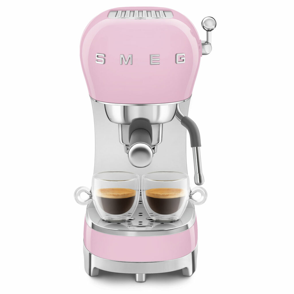 A pink Smeg ECF02 coffee machine